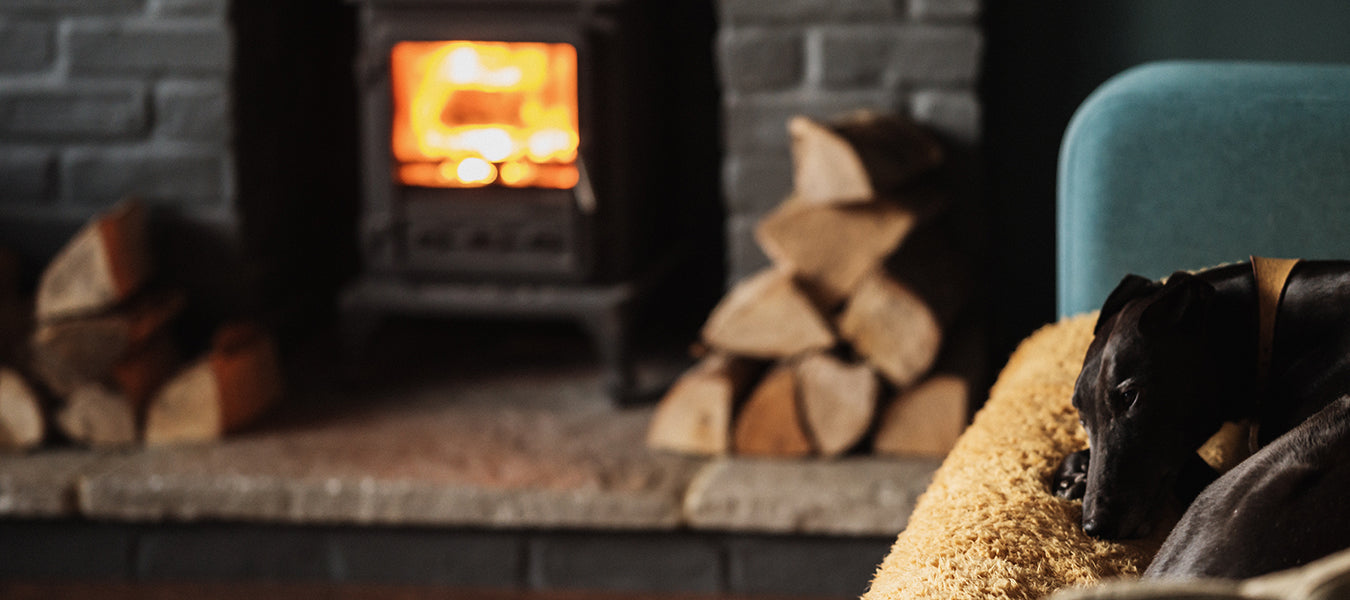 Wood laying next to a fireplace