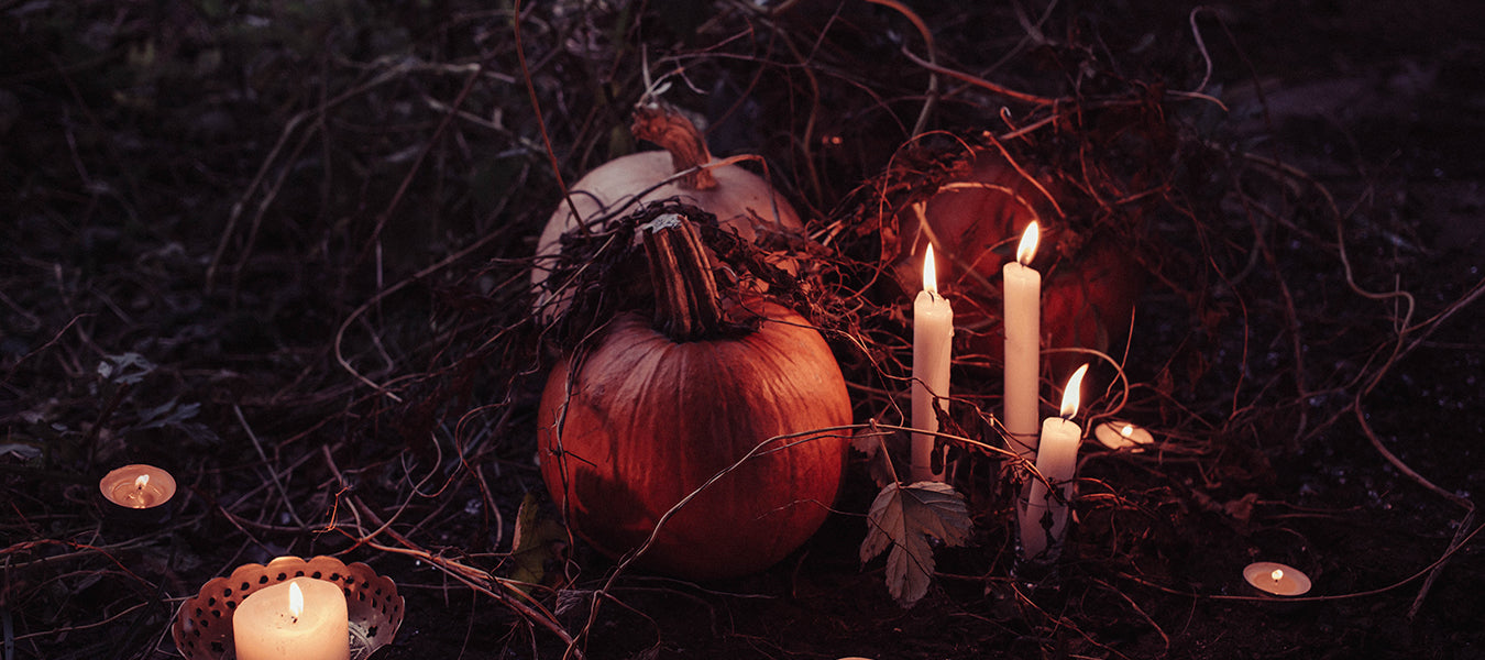 Dark place with a pumpkin and candles nearby